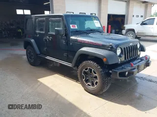 2015 Jeep Wrangler Unlimited Rubicon Hard Rock z VIN 1C4HJWFG0FL550247, wystawiony jako IAAI lot #42474614 z przebiegiem 93 084 mil mil oraz . Historia ofert i sprzedaży dostępna na DreamBid. Obrazek 1.