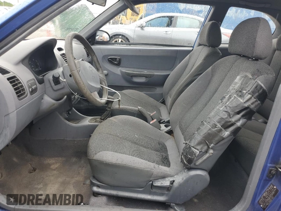 2001 Hyundai Accent z VIN KMHCF35G11U112976, wystawiony jako Copart lot #68692384 z przebiegiem 152 797 mil mil oraz Szkoda całkowita • Salvage title. Historia ofert i sprzedaży dostępna na DreamBid. Obrazek 7.