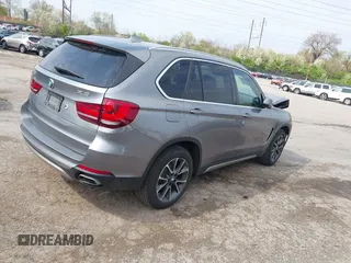 2018 BMW X5 xDrive35i with VIN 5UXKR0C51J0X95114, listed as a IAAI auction lot 42037253 with 80,095 mi miles. Bid and sale history available at carsss.com. Image 4.
