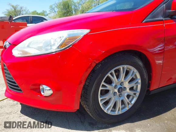 2012 Ford Focus SE z VIN 1FAHP3F23CL333598, wystawiony jako IAAI lot #41970172 z przebiegiem 209 969 mil mil oraz . Historia ofert i sprzedaży dostępna na DreamBid. Obrazek 6.