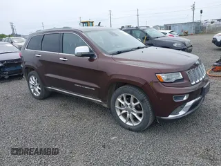 2014 Jeep Grand Cherokee Summit with VIN 1C4RJFJM1EC414001, listed as a IAAI auction lot 42287165 with 130,398 mi miles and . Bid and sale history available at DreamBid. Image 1.