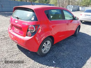 2014 Chevrolet Sonic LT with VIN 1G1JC6SG1E4129835, listed as a IAAI auction lot 42080133 with 94,170 mi miles. Bid and sale history available at carsss.com. Image 4.