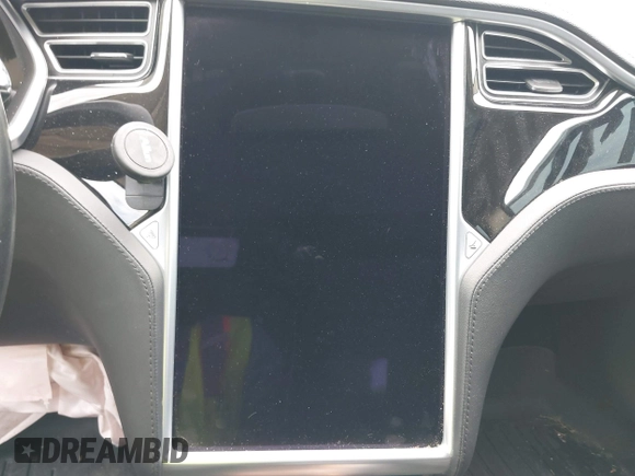 2013 Tesla Model S with VIN 5YJSA1CG9DFP27357, listed as a IAAI auction lot 42362514 with Not provided miles and . Bid and sale history available at DreamBid. Image 7.