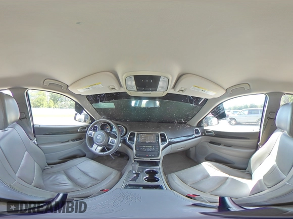 2013 Jeep Grand Cherokee Laredo with VIN 1C4RJEAG2DC519570, listed as a Copart auction lot 52066225 with 129,091 mi miles and Salvage Title. Bid and sale history available at carsss.com. Image 16.