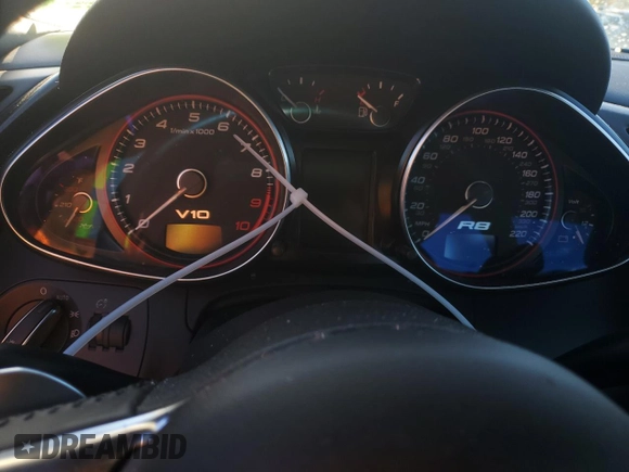 2011 Audi R8 z VIN WUAVNAFG5BN000537, wystawiony jako Copart lot #79313334 z przebiegiem Nie podano mil oraz Szkody całkowita. Historia ofert i sprzedaży dostępna na DreamBid. Obrazek 9.