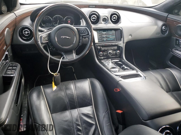 2015 Jaguar XJ with VIN SAJWA2GZ4F8V86379, listed as a Copart auction lot 42624615 with 55,803 mi miles and Salvage Title. Bid and sale history available at carsss.com. Image 8.