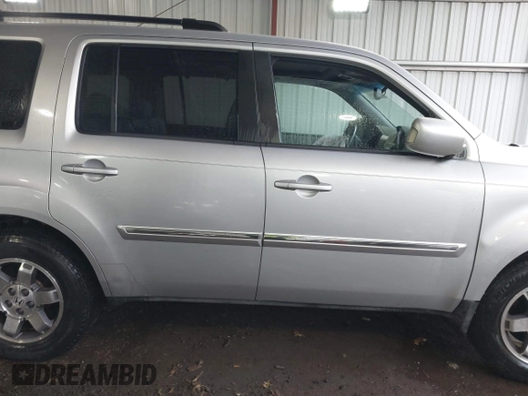 2011 Honda Pilot Touring with VIN 5FNYF4H90BB084692, listed as a IAAI auction lot 41867622 with 62,805 mi miles. Bid and sale history available at carsss.com. Image 13.