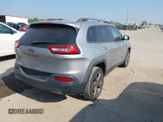 2016 Jeep Cherokee Latitude with VIN 1C4PJLCB7GW256587, listed as a IAAI auction lot 42037539 with 209,267 mi miles. Bid and sale history available at carsss.com. Image 4.
