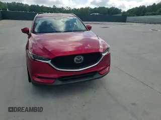 2019 Mazda CX-5 Grand Touring with VIN JM3KFADM2K1657915, listed as a Copart auction lot 56647145 with 85,095 mi miles and Salvage title. Bid and sale history available at DreamBid. Image 14.