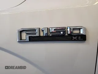 2019 Ford F-150 XL with VIN 1FTEX1E55KKC02870, listed as a IAAI auction lot 42631387 with 206,967 mi miles and . Bid and sale history available at DreamBid. Image 12.