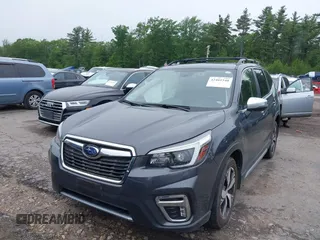 2021 Subaru Forester Touring z VIN JF2SKAXC8MH477969, wystawiony jako IAAI lot #42461540 z przebiegiem 29 143 mil mil oraz . Historia ofert i sprzedaży dostępna na DreamBid. Obrazek 2.