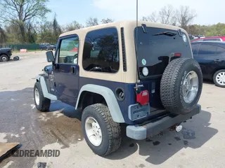 2000 Jeep Wrangler Sport with VIN 1J4FA49S5YP750123, listed as a IAAI auction lot 42060009 with Not Provided miles. Bid and sale history available at carsss.com. Image 3.