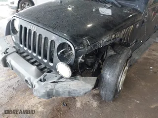 2015 Jeep Wrangler Unlimited Willys Wheeler with VIN 1C4BJWDG9FL652607, listed as a IAAI auction lot 41836193 with 166,152 mi miles. Bid and sale history available at carsss.com. Image 6.