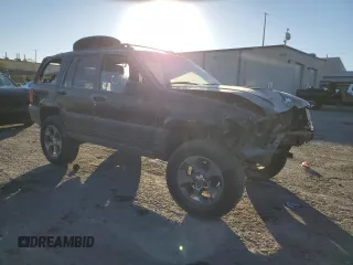 1998 Jeep Grand Cherokee Laredo with VIN 1J4FX58S4WC102623, listed as a Copart auction lot 86188764 with 283,210 mi miles and Salvage Title. Bid and sale history available at carsss.com. Image 4.