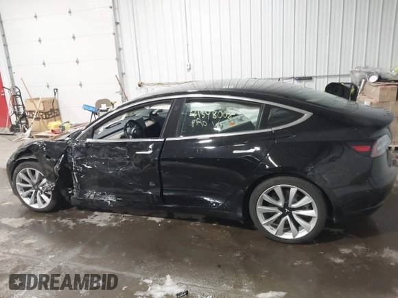 2018 Tesla Model 3 Long Range Battery with VIN 5YJ3E1EB7JF086778, listed as a IAAI auction lot 41348008 with 74,491 mi miles and . Bid and sale history available at DreamBid. Image 14.