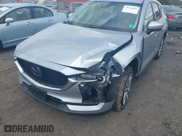 2021 Mazda CX-5 Grand Touring with VIN JM3KFBDM3M0354348, listed as a IAAI auction lot 41924207 with 45,786 mi miles. Bid and sale history available at carsss.com. Image 6.