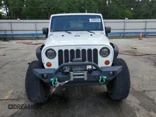 2010 Jeep Wrangler Unlimited Rubicon with VIN 1J4BA6H10AL176014, listed as a Copart auction lot 57092255 with 138,253 mi miles and Salvage title. Bid and sale history available at DreamBid. Image 5.