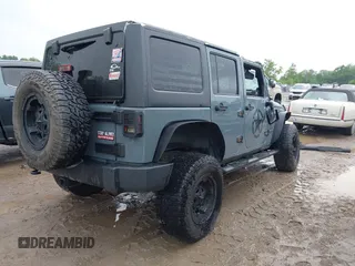 2014 Jeep Wrangler Unlimited Sport with VIN 1C4BJWDG1EL135073, listed as a IAAI auction lot 42435361 with 129,144 mi miles and . Bid and sale history available at DreamBid. Image 4.