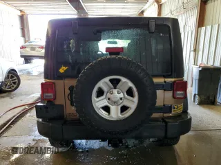 2015 Jeep Wrangler Unlimited Freedom with VIN 1C4BJWDG5FL713046, listed as a Copart auction lot 58563455 with 144,179 mi miles and Salvage title. Bid and sale history available at DreamBid. Image 6.