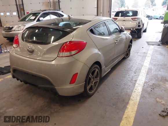 2013 Hyundai Veloster w/Black Int with VIN KMHTC6AD2DU128534, listed as a IAAI auction lot 41791398 with 158,414 mi miles and . Bid and sale history available at DreamBid. Image 4.