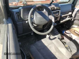 2004 Jeep Wrangler Sport with VIN 1J4FA49S04P751464, listed as a Copart auction lot 61686865 with Not provided miles and Salvage title. Bid and sale history available at DreamBid. Image 8.