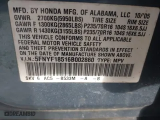 2006 Honda Pilot EX-L with VIN 5FNYF18516B002860, listed as a IAAI auction lot 41963343 with 202,799 mi miles. Bid and sale history available at carsss.com. Image 9.