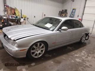 2004 Jaguar XJ with VIN SAJWA71C04SG33993, listed as a IAAI auction lot 41193040 with 79,944 mi miles. Bid and sale history available at carsss.com. Image 17.