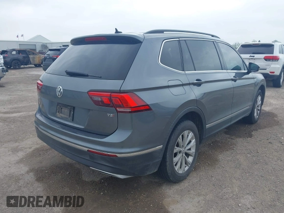2018 Volkswagen Tiguan SEL with VIN 3VV3B7AX3JM000585, listed as a IAAI auction lot 41905836 with 99,114 mi miles and . Bid and sale history available at DreamBid. Image 4.