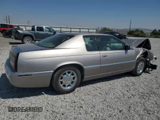 1996 Cadillac Eldorado z VIN 1G6EL12Y3TU618242, wystawiony jako Copart lot #70318844 z przebiegiem Nie podano mil oraz Szkody całkowita. Historia ofert i sprzedaży dostępna na DreamBid. Obrazek 3.