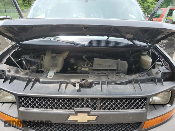 2015 Chevrolet Express Passenger LS with VIN 1GAWGPFG0F1141701, listed as a Copart auction lot 62818685 with 63,219 mi miles and Salvage title. Bid and sale history available at DreamBid. Image 12.