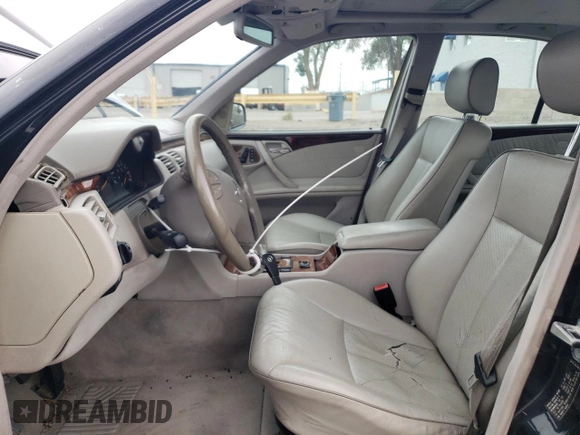 2000 Mercedes-Benz E-Class with VIN WDBJF65J5YB068297, listed as a Copart auction lot 69199004 with 236,751 mi miles and Salvage Title. Bid and sale history available at carsss.com. Image 7.