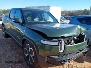 2022 Rivian R1T Adventure Package with VIN 7FCTGAAA2NN006098, listed as a IAAI auction lot 41172815 with 1 mi miles. Bid and sale history available at carsss.com. Image 1.