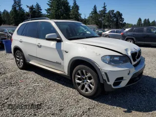 2012 BMW X5 35i with VIN 5UXZV4C5XCL987618, listed as a Copart auction lot 60308965 with 98,195 mi miles and Salvage title. Bid and sale history available at DreamBid. Image 4.