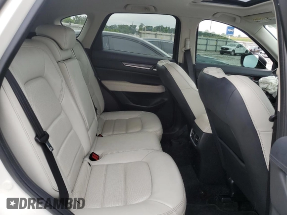 2019 Mazda CX-5 Grand Touring with VIN JM3KFADM6K1581261, listed as a Copart auction lot 59965175 with 127,837 mi miles and Salvage title. Bid and sale history available at DreamBid. Image 10.