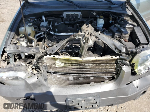 2006 Ford Escape XLS z VIN 1FMYU02Z36KB10195, wystawiony jako Copart lot #53108415 z przebiegiem Nie podano mil oraz Szkoda całkowita • Salvage title. Historia ofert i sprzedaży dostępna na DreamBid. Obrazek 14.
