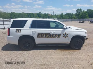 2020 Chevrolet Tahoe Commercial with VIN 1GNLCDECXLR154849, listed as a IAAI auction lot 42050778 with 124,771 mi miles and . Bid and sale history available at DreamBid. Image 14.