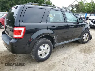 2012 Ford Escape XLS with VIN 1FMCU9C71CKA30319, listed as a Copart auction lot 60189745 with 214,736 mi miles and Salvage title. Bid and sale history available at DreamBid. Image 3.