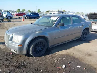 2006 Chrysler 300 Touring with VIN 2C3LA53G66H170047, listed as a IAAI auction lot 42135663 with 215,285 mi miles. Bid and sale history available at carsss.com. Image 2.