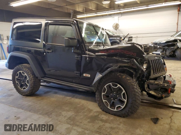 2013 Jeep Wrangler Rubicon with VIN 1C4HJWCG6DL666540, listed as a Copart auction lot 79337404 with 130,448 mi miles and Salvage title. Bid and sale history available at DreamBid. Image 4.