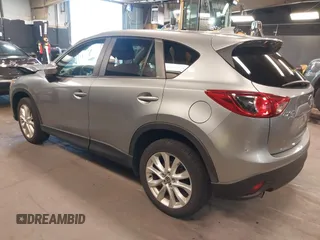 2014 Mazda CX-5 Grand Touring with VIN JM3KE4DY9E0373974, listed as a IAAI auction lot 42073693 with 86,755 mi miles. Bid and sale history available at carsss.com. Image 3.