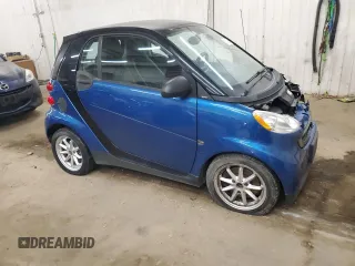 2009 Smart fortwo Pure z VIN WMEEJ31X99K209790, wystawiony jako Copart lot #51102685 z przebiegiem 30 389 mil mil oraz Szkody całkowita. Historia ofert i sprzedaży dostępna na DreamBid. Obrazek 4.
