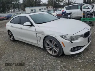 2015 BMW 4 Series 428i with VIN WBA4A5C52FGK15623, listed as a Copart auction lot 49856825 with 144,135 mi miles and Salvage Title. Bid and sale history available at DreamBid. Image 4.