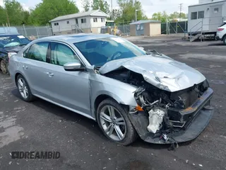 2014 Volkswagen Passat SE z VIN 1VWBT7A32EC070023, wystawiony jako IAAI lot #42202567 z przebiegiem 116 438 mil mil oraz . Historia ofert i sprzedaży dostępna na DreamBid. Obrazek 1.
