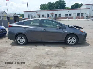 2021 Toyota Prius L Eco z VIN JTDKAMFU3M3152785, wystawiony jako IAAI lot #42501351 z przebiegiem 60 489 mil mil oraz . Historia ofert i sprzedaży dostępna na DreamBid. Obrazek 13.