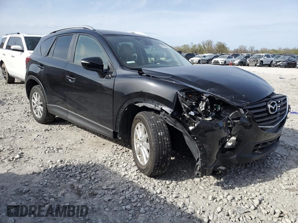 2016 Mazda CX-5 Touring z VIN JM3KE4CY0G0667171, wystawiony jako Copart lot #51579005 z przebiegiem 39 487 mil mil oraz Szkoda całkowita • Salvage title. Historia ofert i sprzedaży dostępna na DreamBid. Obrazek 4.