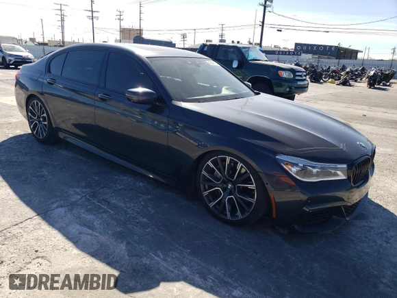2019 BMW 7 Series 750i with VIN WBA7F0C56KGM25430, listed as a Copart auction lot 42048135 with 74,717 mi miles and Salvage title. Bid and sale history available at DreamBid. Image 4.