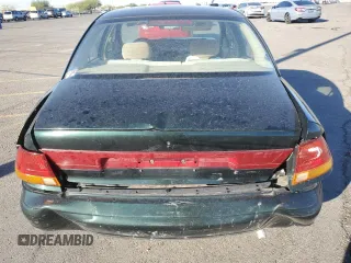 1996 Saturn SL with VIN 1G8ZK5272TZ137198, listed as a Copart auction lot 72446614 with 99,586 mi miles and Salvage title. Bid and sale history available at DreamBid. Image 6.
