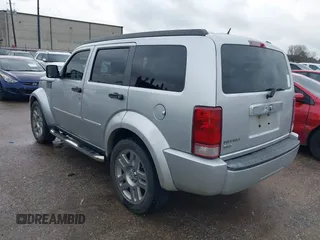 2008 Dodge Nitro SLT with VIN 1D8GT58K58W127412, listed as a IAAI auction lot 41544874 with 232,748 mi miles. Bid and sale history available at carsss.com. Image 3.