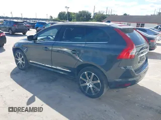 2015 Volvo XC60 T5 Drive-E Premier Plus with VIN YV440MDC7F2606774, listed as a IAAI auction lot 41564034 with 166,758 mi miles. Bid and sale history available at carsss.com. Image 3.