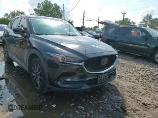 2018 Mazda CX-5 Grand Touring with VIN JM3KFBDM6J0345848, listed as a Copart auction lot 61587865 with 107,193 mi miles and Salvage title. Bid and sale history available at DreamBid. Image 14.